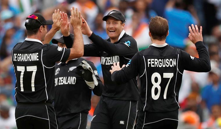 New Zealand's Martin Guptill celebrates with teammates after running Dhoni out in the World Cup 2019 semifinal at Old Trafford in Manchester | Reuters