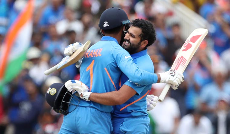 Rohit Sharma (right) hugs teammate K.L. Rahul while celebrating his century during the World Cup group match between Bangladesh and India at Edgbaston in Birmingham | AP