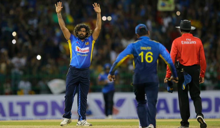 Lasith Malinga (left), who played his last ODI match, acknowledges the crowd after Sri Lanka defeated Bangladesh by 91 runs in the first ODI in Colombo | AP