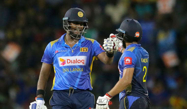 Sri Lanka's Kusal Mendis, right, and Angelo Mathews celebrate their victory over Bangladesh in the second one-day international cricket match in Colombo, Sri Lanka | AP