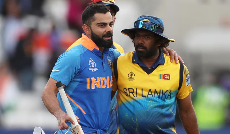 Virat Kohli and Lasith Malinga, who played his last World Cup match, congratulate each other after the game at Headingley, Leeds | Reuters