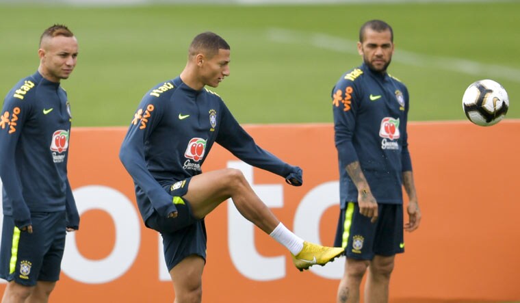 Brazil's Everton (left), Richarlison (centre) and Dani Alves take part in a training session ahead of the Copa America final against Peru | AFP