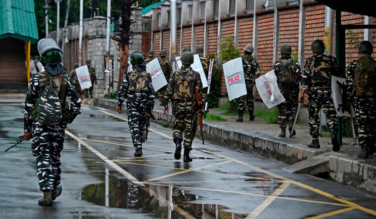 Security personnel patrol during a lockdown in Srinagar on August 10 | AFP