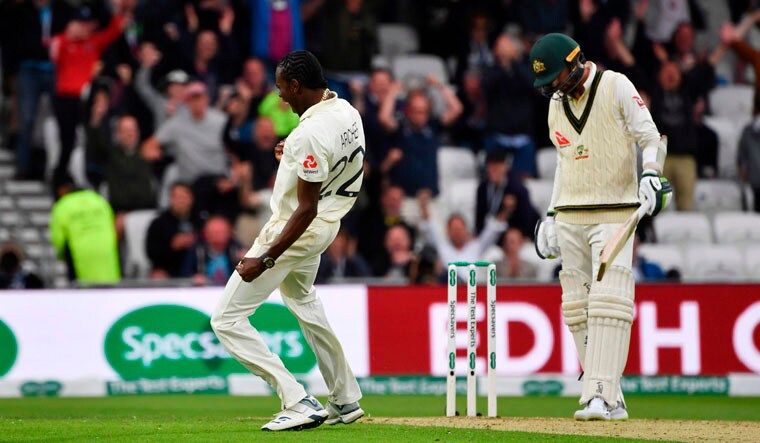 England's Jofra Archer (L) celebrates taking the wicket of Australia's Nathan Lyon (R) on the first day of the third Ashes cricket Test match  | AFP