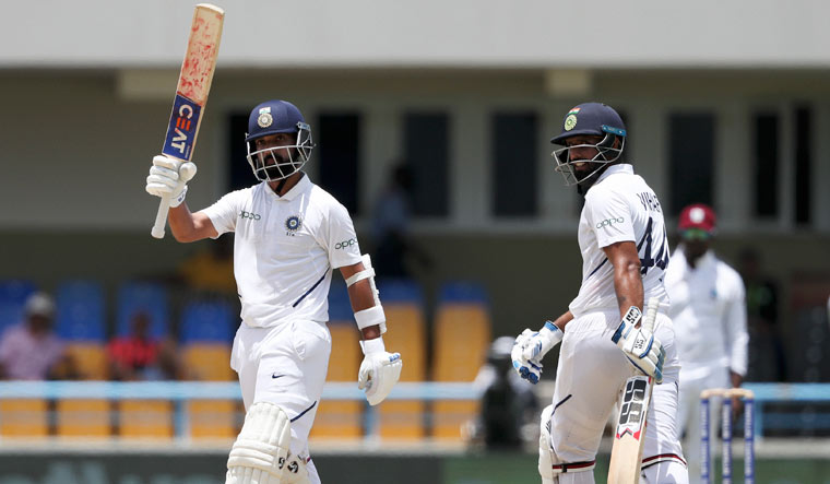 Ajinkya Rahane celebrates after he scored a century against West Indies | AP