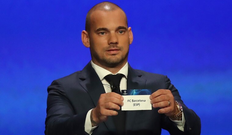 Wesley Sneijder shows the name of Barcelona at the UEFA Champions League group stage draw at the Grimaldi Forum, in Monaco | AP
