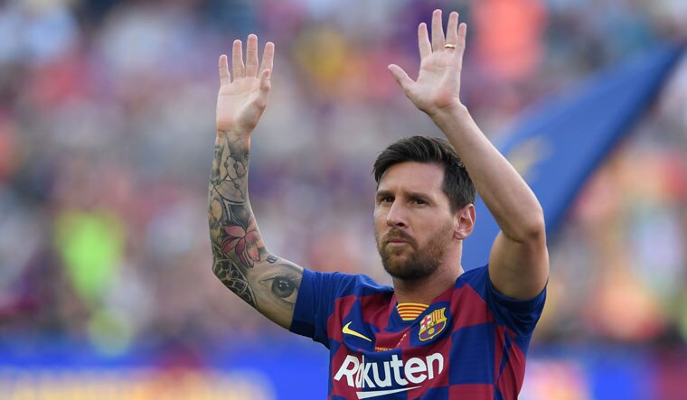 Barcelona's Argentinian forward Lionel Messi waves before the 54th Joan Gamper Trophy friendly match against Arsenal at the Camp Nou stadium in Barcelona | AFP
