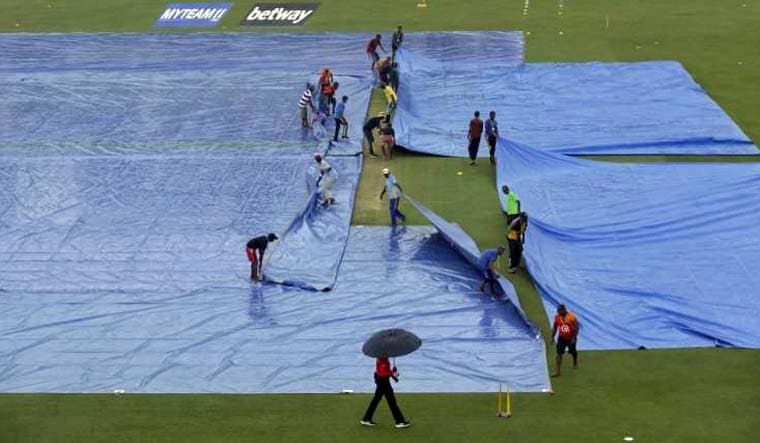 Field at the Providence Stadium being covered up because of the rains | AP