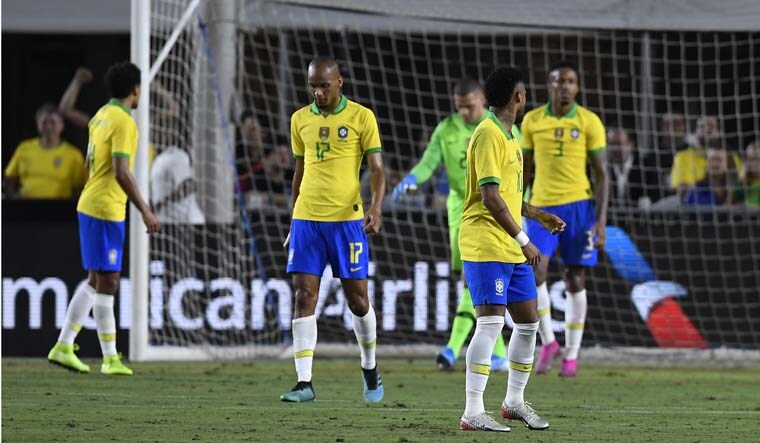 Fabinho and Neymar of Brazil react after a goal Luis Abram of Peru in the 2019 International Champions Cup