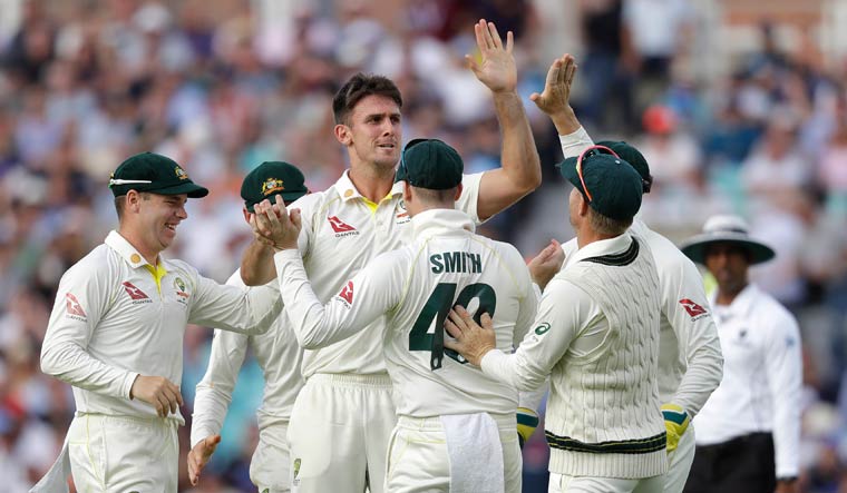 Australia's Mitchell Marsh celebrates taking the wicket of England's Sam Curran | AP