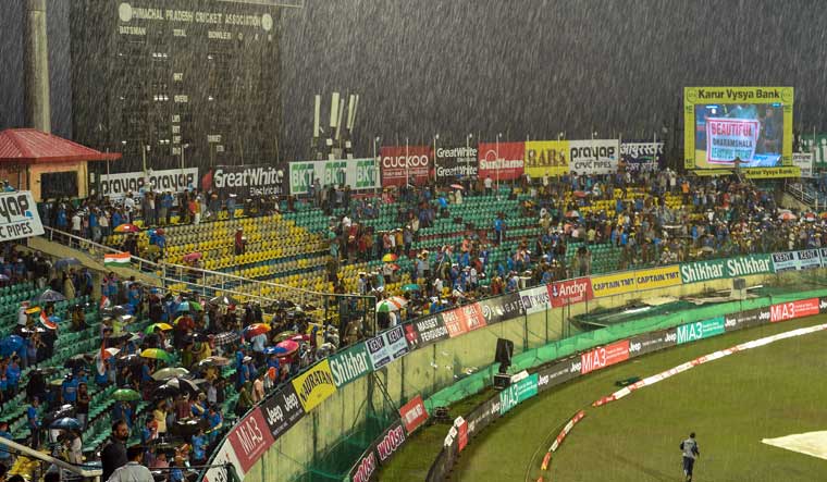 Spectators seen at the HPCA stadium as it rains ahead of India's first T-20 cricket match against South Africa in Dharamshala | PTI