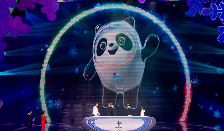The mascot for the Beijing 2022 Winter Olympic, 'Bing Dwen Dwen', is projected to a screen on the stage during the official reveal of the mascots at Shougang Ice Hockey Arena | AFP