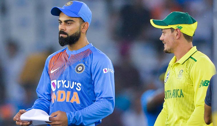 India captain Virat Kohli (left) and his South African counterpart Quinton de Kock during the toss at the second T20I match at Punjab Cricket Association Stadium in Mohali | AFP