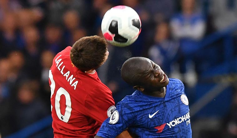 Liverpool's English midfielder Adam Lallana (L) vies with Chelsea's French midfielder N'Golo Kante (R) | AFP