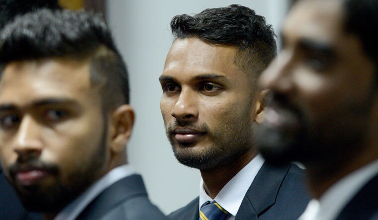 Sri Lanka's T20 cricket team captain Dasun Chanaka (centre) looks on prior to the team's departure from Colombo for the Pakistan tour | AFP
