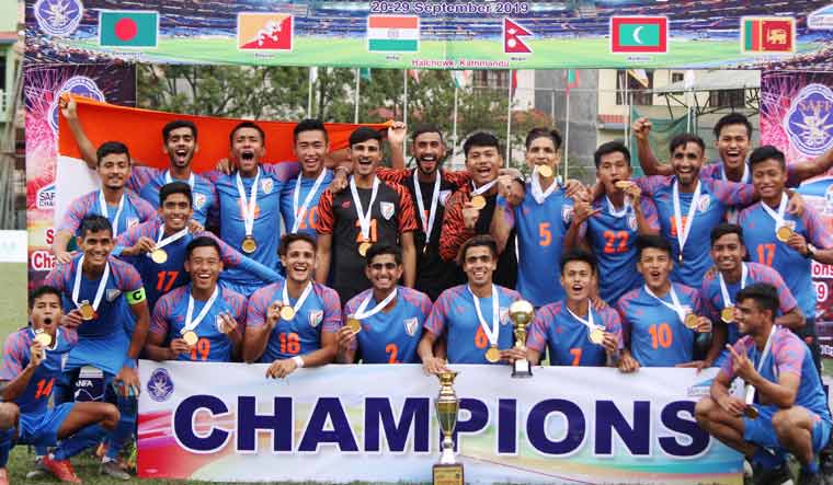 The Indian football team poses with the trophy after winning the SAFF U-18 Championship, in New Delhi | via Twitter