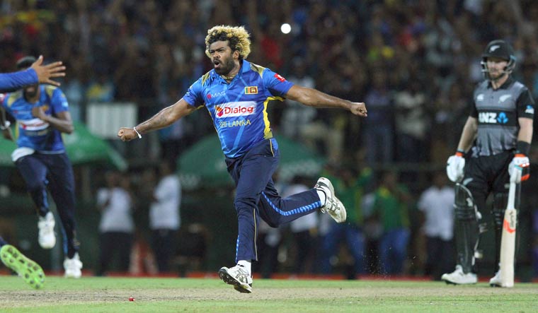 Lasith Malinga celebrates after taking the hat-trick wicket of New Zealand's Colin de Grandhomme during the third T20I in Pallekele | AP