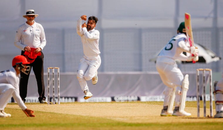 Afghanistan's cricketer Rashid Khan delivers a ball during the second day of the one-off cricket Test match between Bangladesh and Afghanistan at the Zohur Ahmed Chowdhury Stadium in Chittagong on September 6, 2019 | AFP