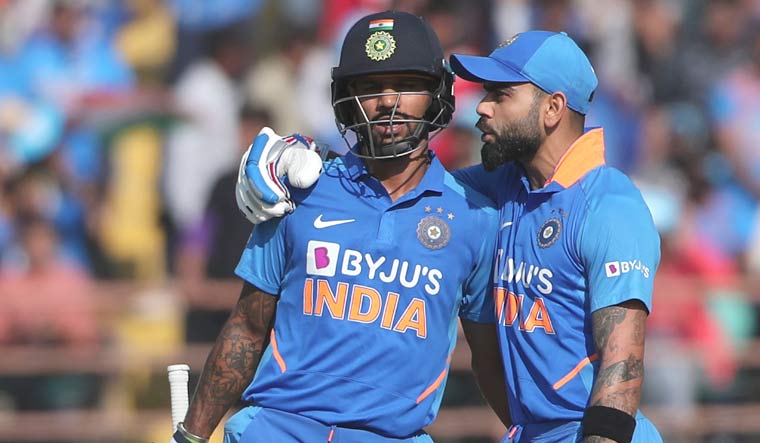 India captain Virat Kohli (right) talks with Shikhar Dhawan during the second ODI match between India and Australia in Rajkot | AP