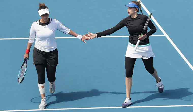 Tennis star Sania Mirza and her partner Nadiia Kichenok of Ukraine who won the WTA Hobart International trophy defeating Shaui Peng and Shuai Zhang in the finals | PTI