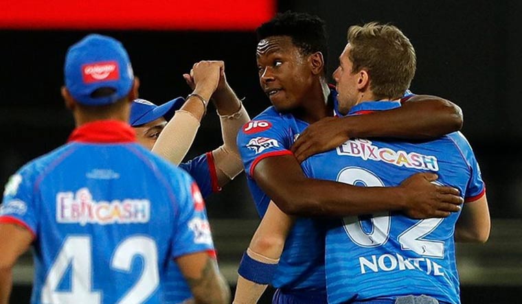 Delhi Capitals players celebrate the wicket of Robin Uthappa of Rajasthan Royals during their IPL 2020 match at the Dubai International Cricket Stadium | iplt20.com