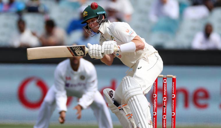 Australia's Steve Smith attempts to avoid a bouncer while batting on day three of the second Test match against India | AP