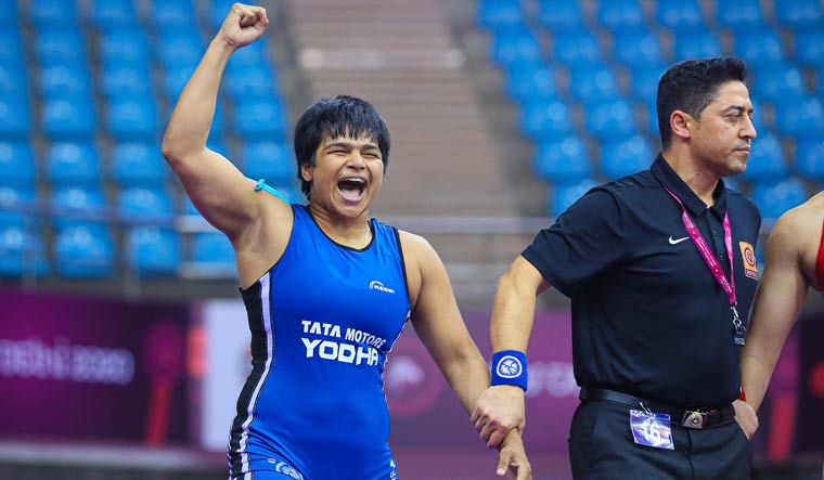 Divya Kakran celebrates after winning her bout at the Asian Wrestling Championships | Sourced image