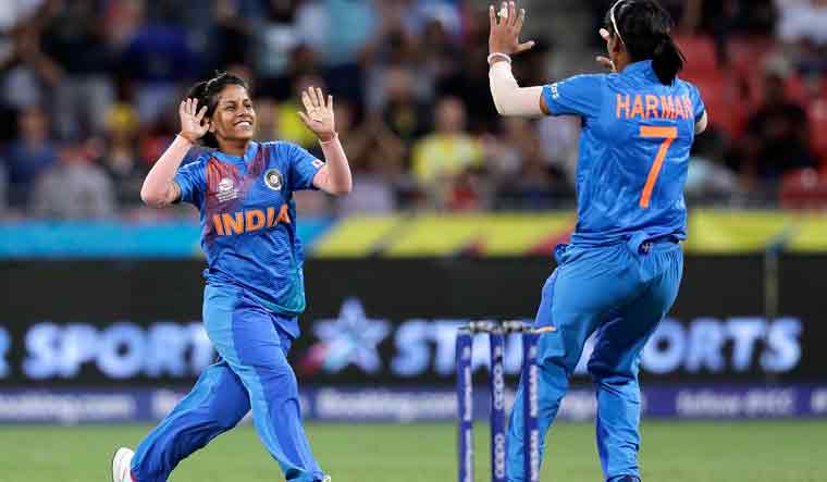 Poonam Yadav [left] celebrates with teammate Harmanpreet Kaur after taking the wicket of Australia's Jess Jonassen during the first game of the Women's T20 Cricket World Cup in Sydney on Friday | AP