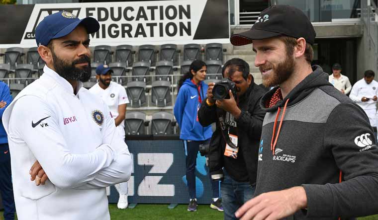 New Zealand captain Kane Williamson (right) talks to India captain Virat Kohli after the Kiwis won the Test series | AFP