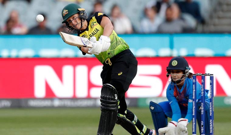 Australia's Alyssa Healy plays a shot as India's Tanya Bhatia looks on during the Women's T20 World Cup final | AP
