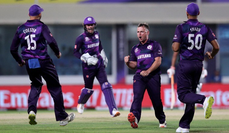 Scotland's Chris Greaves (second from right) celebrates with teammates after taking the wicket of Mushfiqur Rahim in the T20 World Cup match against Bangladesh | Scotland Twitter