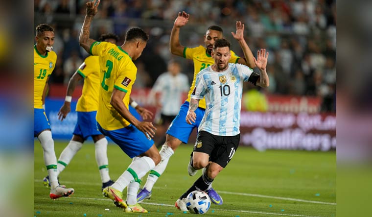 Argentina's Lionel Messi dribbles away from Brazil's Matheus Cunha and Danilo during the 2022 World Cup qualifier in San Juan, Argentina | AP