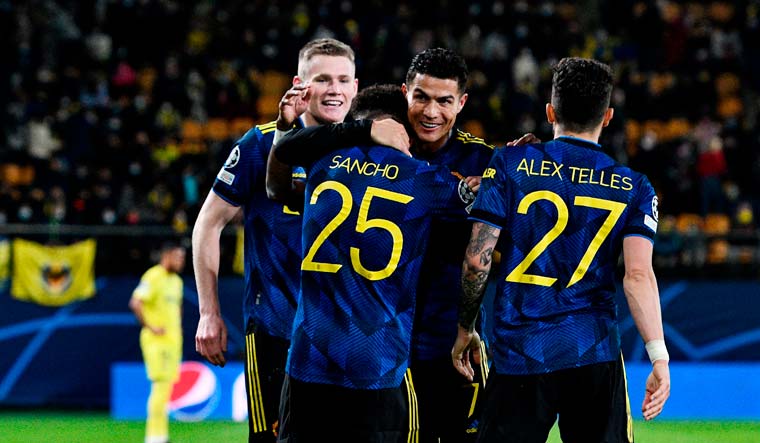Manchester United's Jadon Sancho celebrates with Cristiano Ronaldo after scoring in the Champions League match against Villareal | Reuters