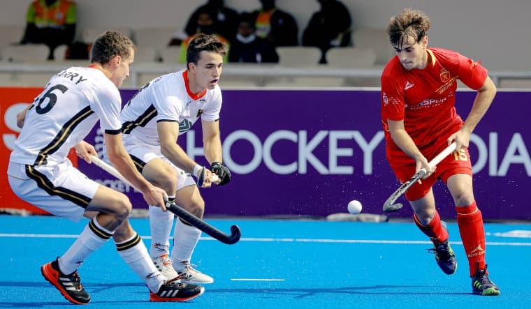 German and Spanish players vie for the ball during the quarterfinal match of the Junior Hockey World Cup in Bhubaneshwar | FIH Twitter