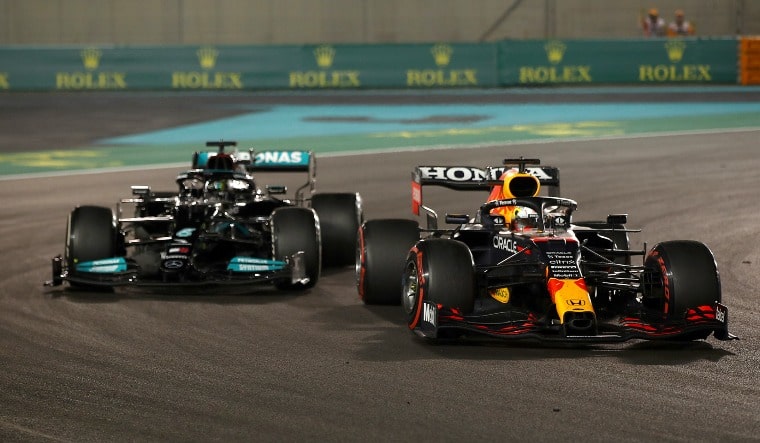 Max Verstappen (right) overtakes Lewis Hamilton in the final lap of the 2021 Abu Dhabi Formula One GP | Twitter