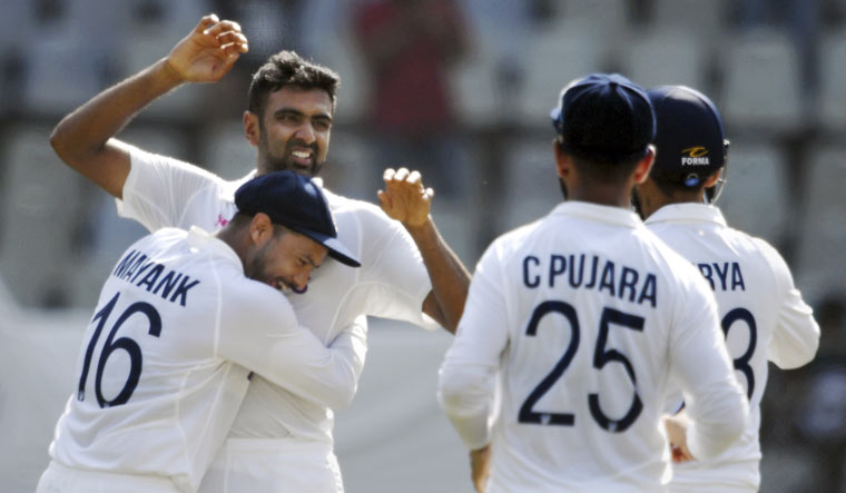 Ravichandran Ashwin celebrates the wicket of New Zealand batter Henry Nicholls during the second day of the second Test match between India and New Zealand, at Wankhede stadium in Mumbai | PTI