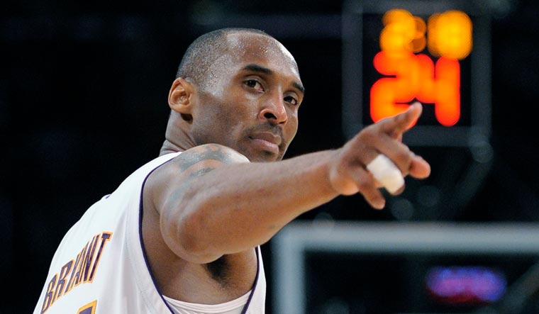 In this June 7, 2009, file photo, Los Angeles Lakers guard Kobe Bryant (24) points to a player behind him after making a basket in the closing seconds against the Orlando Magic in Game 2 of the NBA basketball finals in Los Angeles | AP