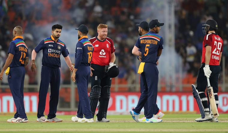 England's Jonny Bairstow (fourth right) and teammate Dawid Malan (right) shake hands with Indian players after winning the first T20I match at Narendra Modi Stadium in Ahmedabad | AP