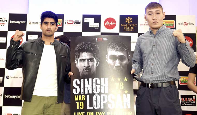 Vijender Singh with Russia's Artysh Lopsan during a press conference in New Delhi ahead of their fight at Majestic Pride Casino Ship in Goa | PTI