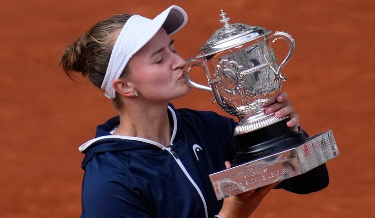 Czech Republic's Barbora Krejcikova kisses the French Open trophy after defeating Russia's Anastasia Pavlyuchenkova in the final at the Roland Garros stadium | AP