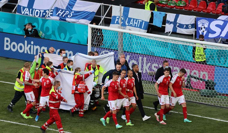 Paramedics using a stretcher to take out of the pitch Denmark's Christian Eriksen after he collapsed | AP