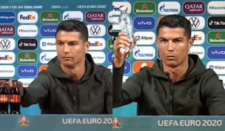 Cristiano Ronaldo replacing two Coca-Cola bottles with a bottle of water at a press conference ahead of Portugal's Euro game against Hungary | via Twitter