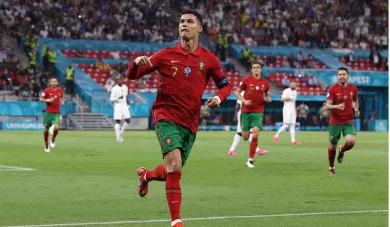 Portugal's Cristiano Ronaldo celebrates after scoring his side's second goal against France | AP