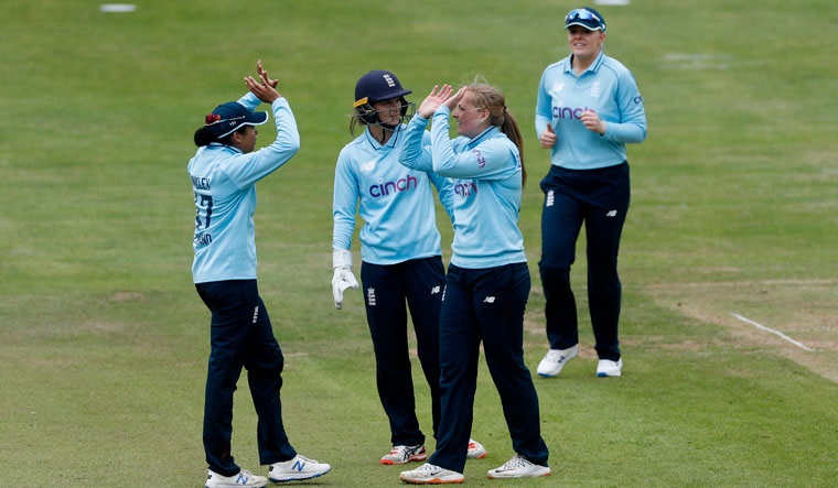 England’s Sophie Ecclestone celebrates with teammates the wicket of India’s Pooja Vastrakar | Reuters