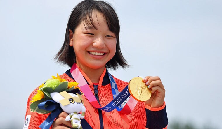 Momiji Nishiya of Japan poses with her gold medal for women's street skateboarding  | Reuters