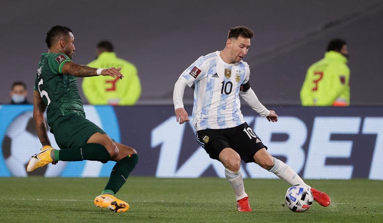 Lionel Messi (right) in action against Bolivia | Reuters