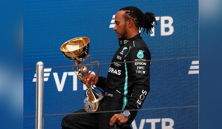 Lewis Hamilton with the Russian GP trophy, his 100th F1 victory | Reuters