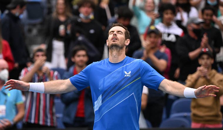 Andy Murray celebrates winning his first round match against Georgia's Nikoloz Basilashvili at the Australian Open | Reuters