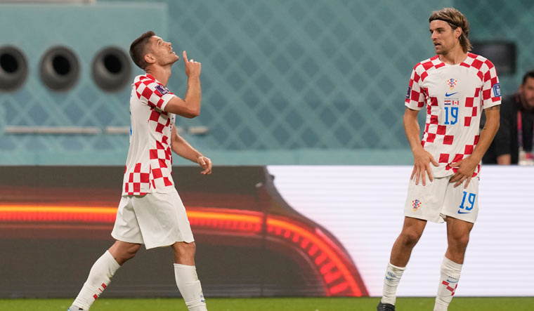 Croatia's Andrej Kramaric, left, celebrates after scoring his side's third goal against Canada | AP