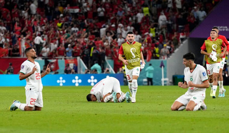 Morocco players react after defeating Belgium 2-0 during the World Cup group F soccer match, at the Al Thumama Stadium in Doha, Qatar, Sunday, Nov. 27, 2022. (AP Photo/Alessandra Tarantino)